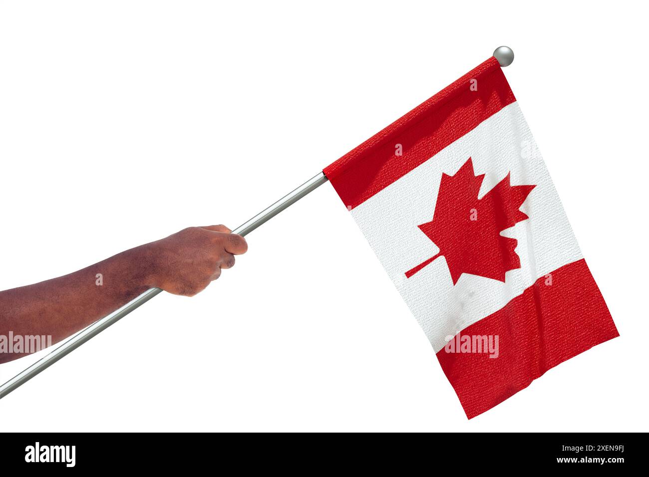 Ausgereckte schwarze afrikanische Hand hält die kanadische Nationalflagge isoliert über weißem Hintergrund, Protest, Winken, Faust, Freiheit Stockfoto