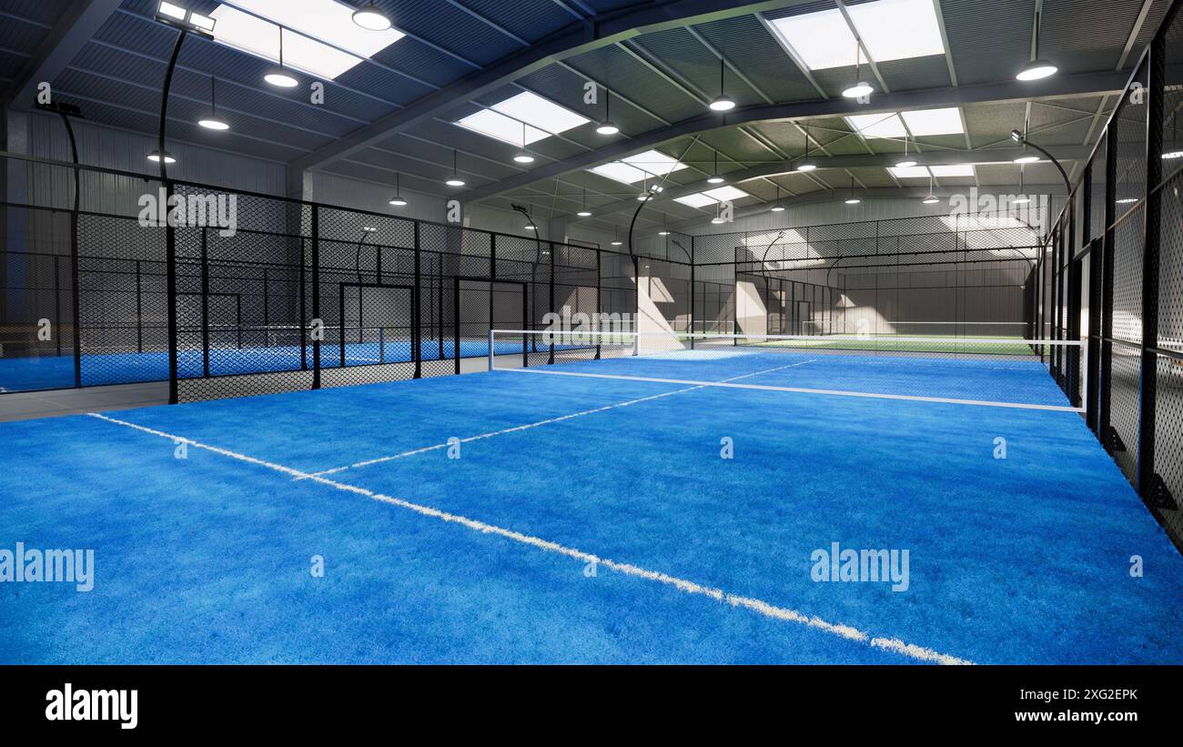 Blaue Padel-Tennisplätze in einem Lagergebäude im Bereich des Sportkomplexes. Die Lichter sind immer noch an, obwohl es tagsüber ist Stockfoto