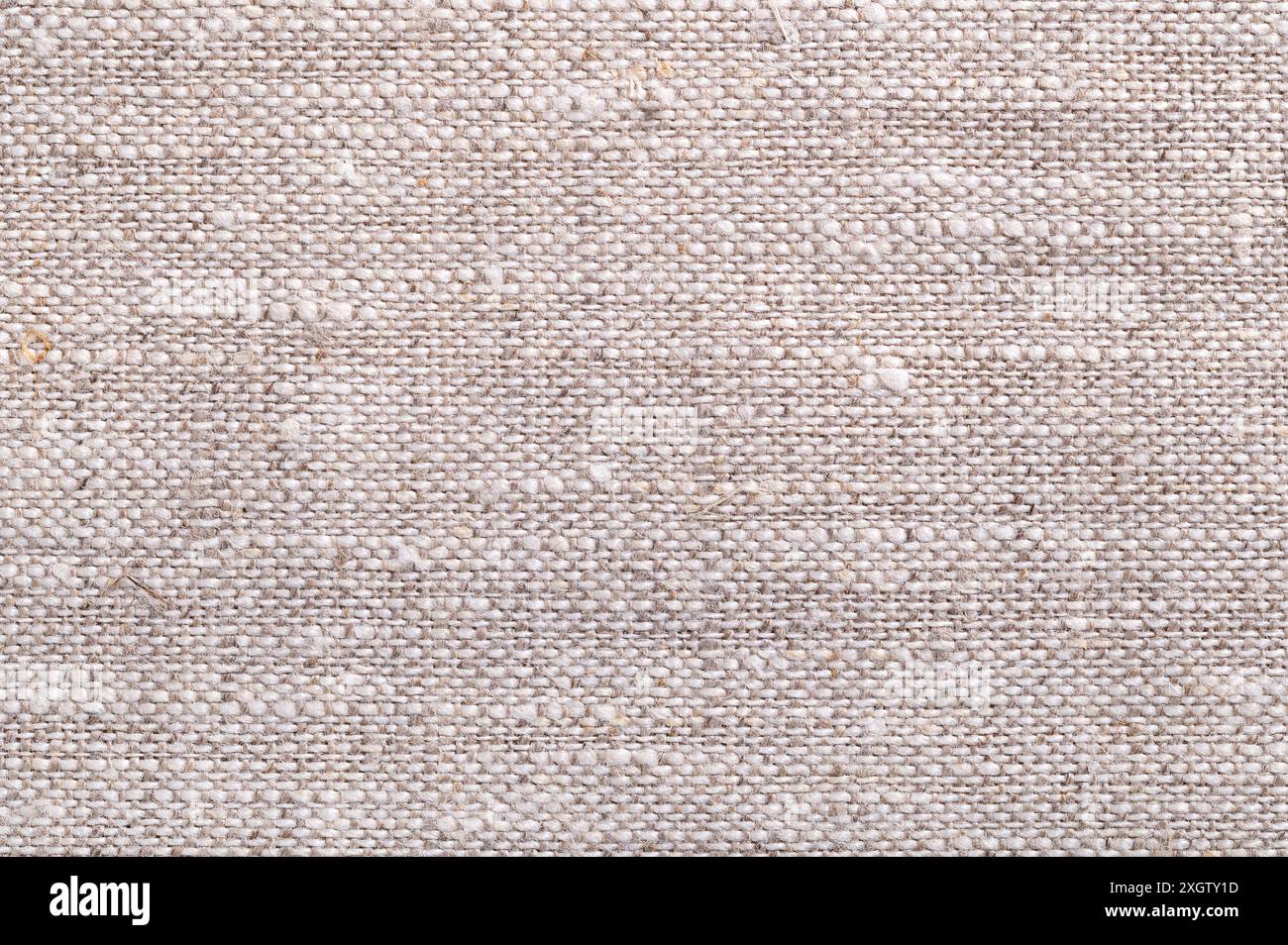 Oberfläche aus grobem Leinengewebe, von oben. Sehr saugfähiges und starkes Textil aus den Fasern der Flachspflanze. Stockfoto