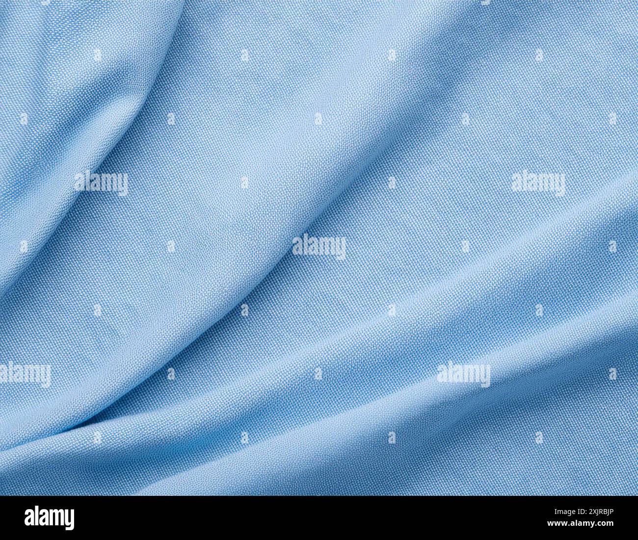 Weiche, pastellblaue Leinenstruktur mit natürlicher, gewebter Oberfläche für sanfte, leichte Designs Stockfoto