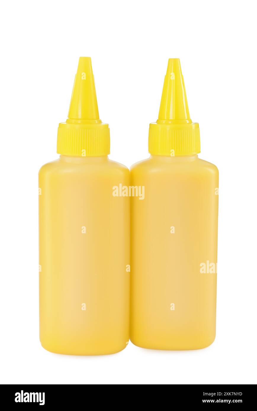 Flaschen mit gelber Druckertinte isoliert auf weiß Stockfoto