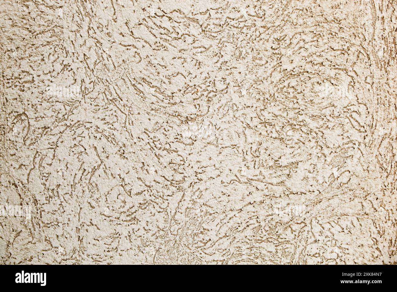 Alte Wandstruktur. Außenverkleidung des Hauses. Putzwand mit Löchern. Textur. Hintergrund. Stockfoto