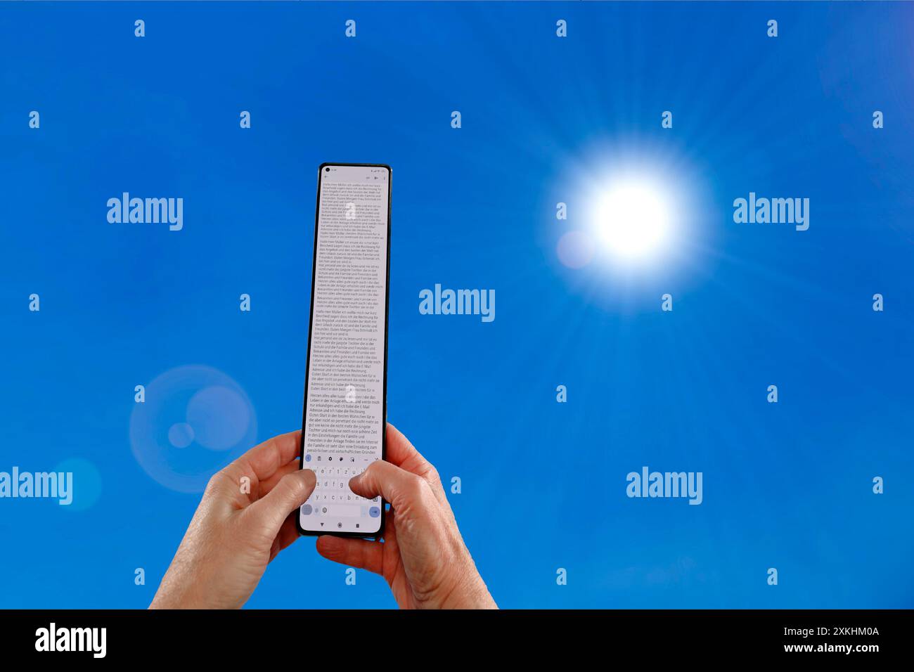 Handy Handy Handy Extra Plus XXL Super Long und Sonne, Satire Stockfoto