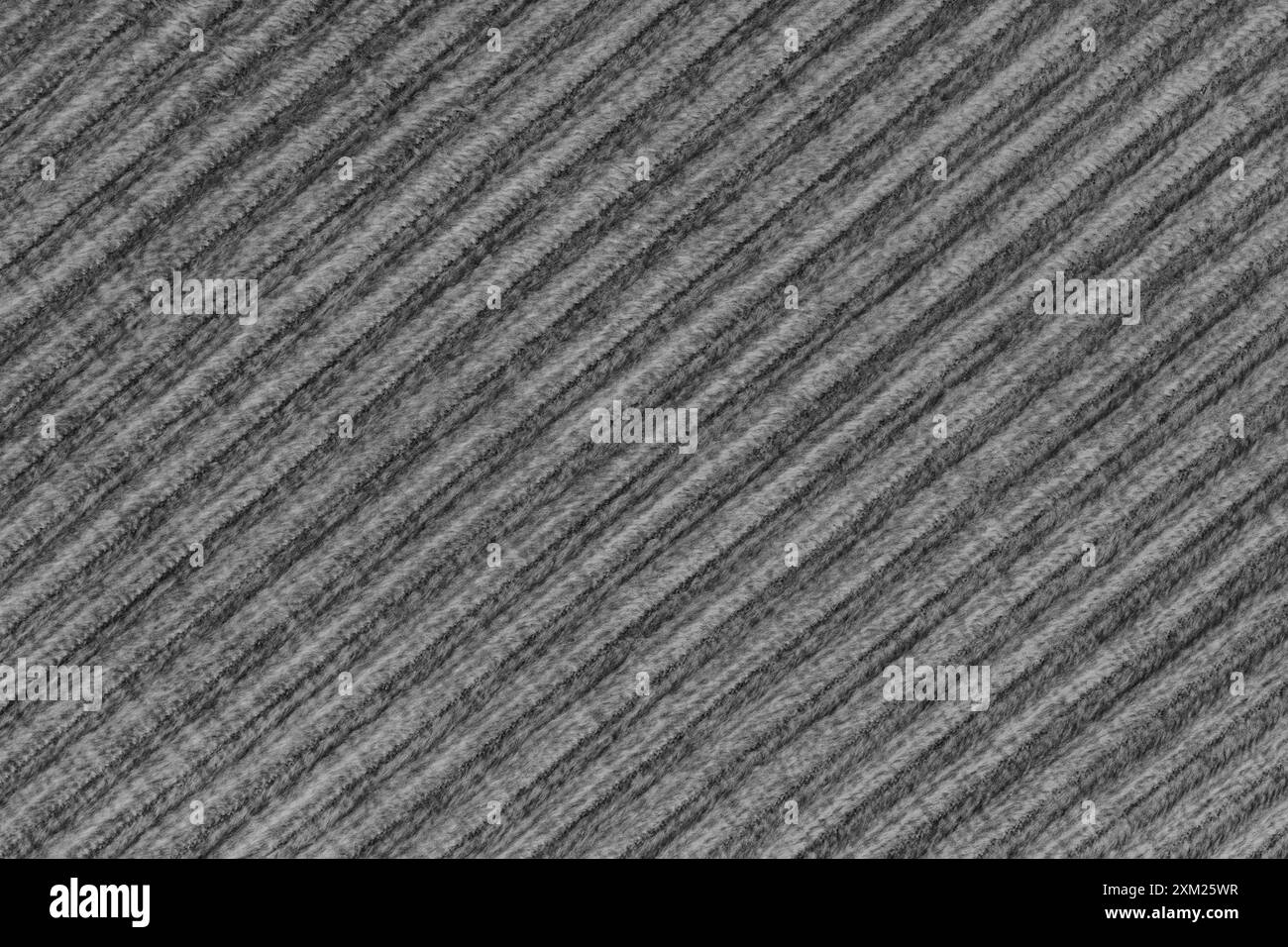 Ridge-Textur-Hintergrund aus schwarzem Velours-Cordtuch. Große gerippte, diagonale, grobe Samtgewebe, gestreifte Polstertextilien, Möbel Stockfoto