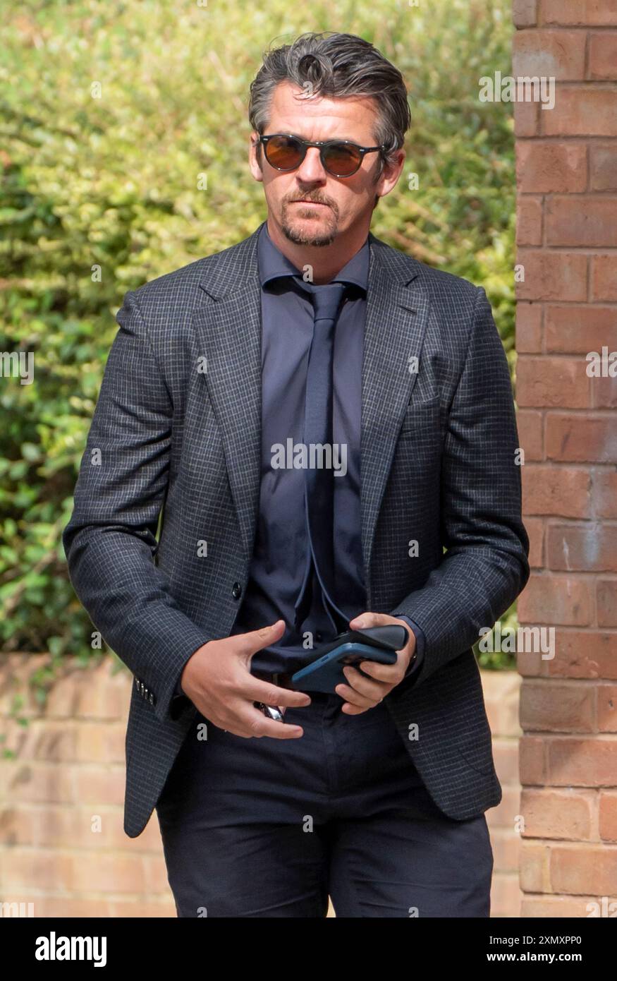 Joey Barton verlässt das Crown and Magistrates Court Centre in Warrington, wo er wegen bösartiger Kommunikationsdelikte beschuldigt wird. Die Anklage betrifft Tweets, die er über den Fußballexperten Eni Aluko während eines FA-Cup-Spiels schickte, das sie für die BBC im Januar kommentierte. Bilddatum: Dienstag, 30. Juli 2024. Stockfoto