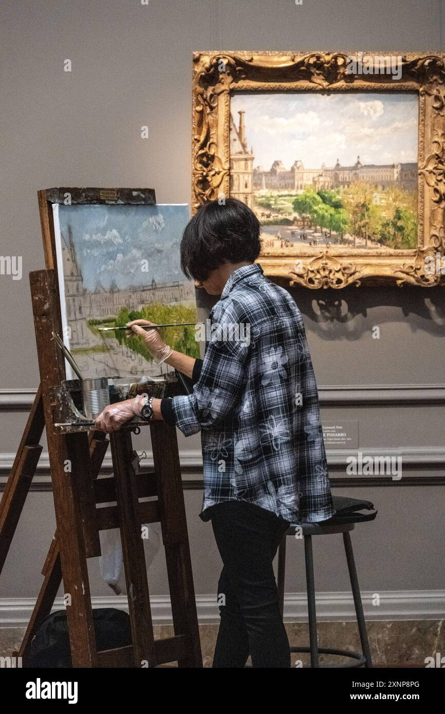 Künstlerinnen in der Washington DC National Gallery malen eine eigene Version eines Camille Pissarro-Gemäldes Stockfoto
