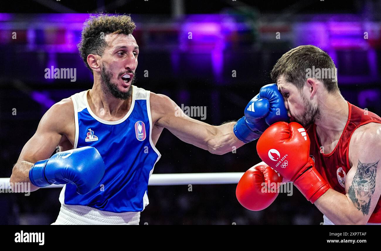 Paris, Frankreich. August 2024. Sofiane Oumiha (L) aus Frankreich tritt mit Wyatt Sanford aus Kanada während des 63 kg schweren Boxhalbfinals bei den Olympischen Spielen 2024 in Paris, Frankreich, am 4. August 2024 an. Quelle: Jiang Wenyao/Xinhua/Alamy Live News Stockfoto