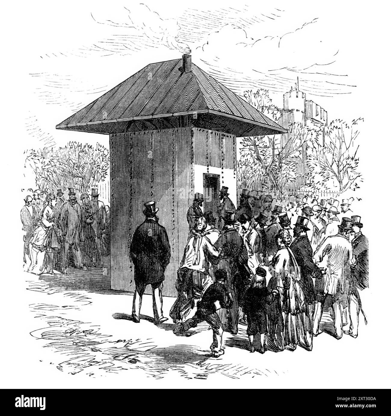 The Thames Subway am Tower-Hill: Eingang zum Tunnel, 1870. Tunnel unter der Themse in London, entworfen von William Henry Barlow. "Die obere Öffnung jedes Schachts ist von einem kleinen quadratischen Gebäude bedeckt, an dessen Tür die Fahrgäste ihre Fahrkarten nehmen, dann im Aufzug ein- und absteigen. Beim Erreichen des Bodens finden sie einen Abstand von ein paar Metern zwischen dem Schacht und den Puffern, die mit Bänken ausgestattet sind, als Warteraum... Auf der Bahn fährt ein Omnibus, der zwölf Passagiere befördert... wenn der Omnibus ankommt und seine Ladung entladen hat, treten die Wartenden ein und starten für den anderen Stockfoto