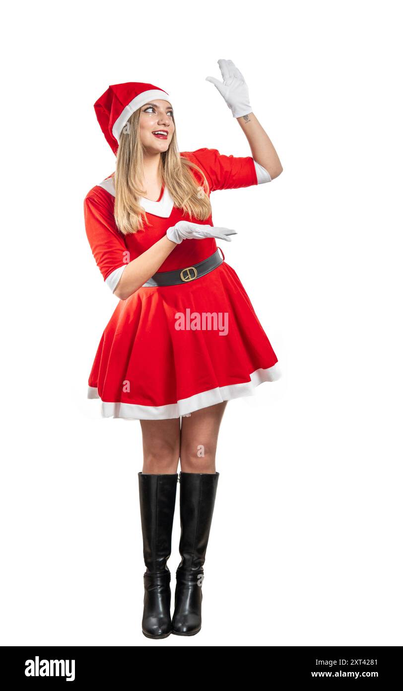 Junge Weihnachtsmann lächelt mit offenen Händen und lässt Platz für ein Produkt oder eine Botschaft zu Weihnachten Stockfoto