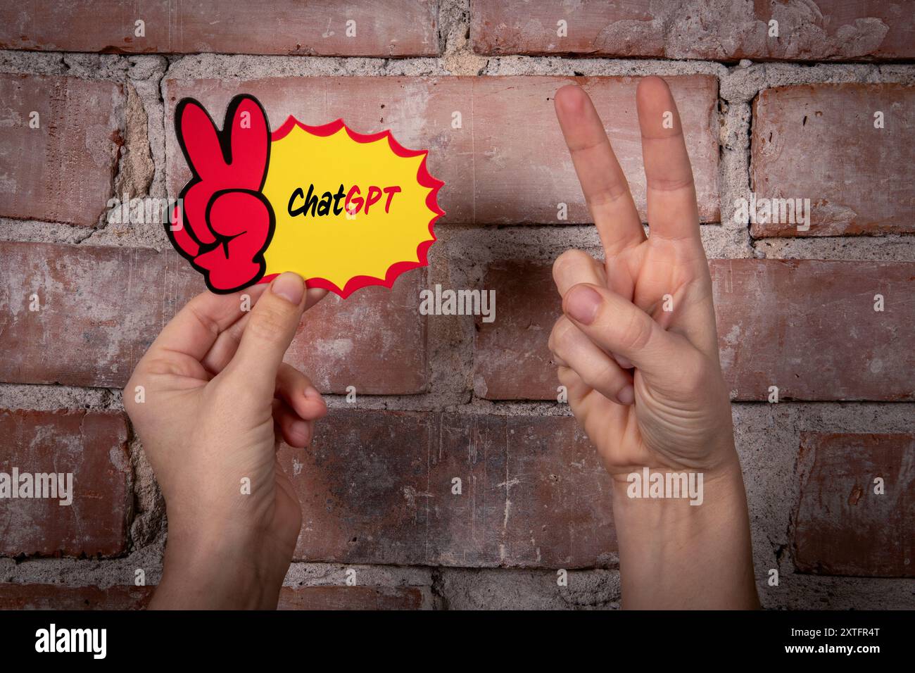 ChatGPT. Haftnotiz mit Text auf rotem Backsteinhintergrund. Stockfoto