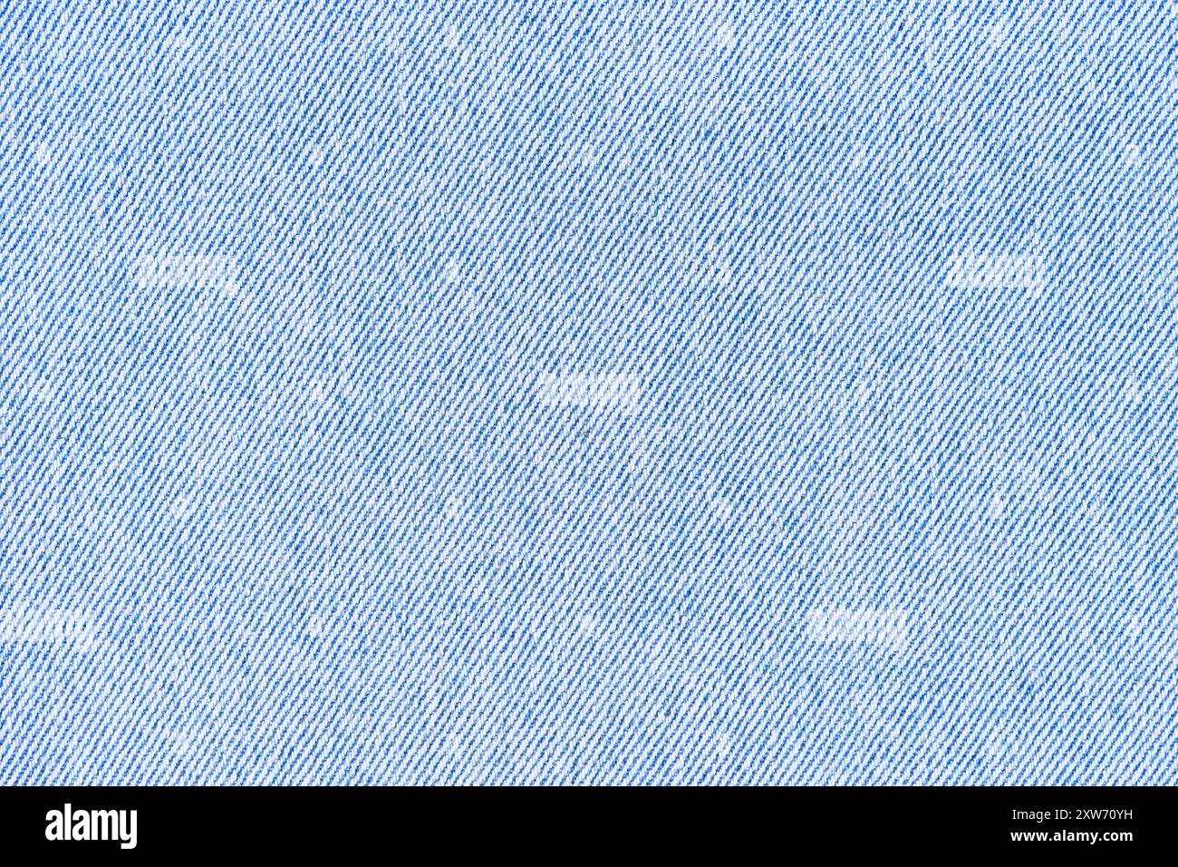 Nahaufnahme, Makro aus blauem Jeans-Denim-Textur-Hintergrund. Diagonalwebstoff, Leinwand. Textil für Dekor, Polster, Kleidung. Hintergrundbild, Stockfoto