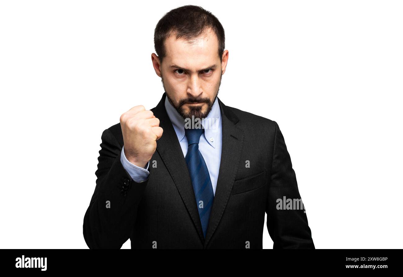 Junger attraktiver Geschäftsmann in einem Anzug mit einer Faust auf weißem Hintergrund Stockfoto