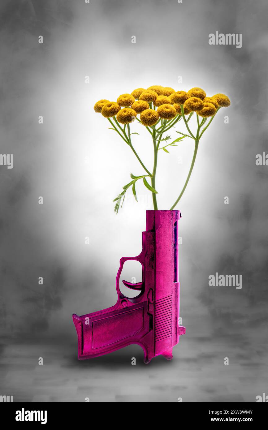 Gelbe Blumen in einem rosafarbenen Gewehrlauf, um Frieden und die Ablehnung von Waffen zu veranschaulichen Stockfoto