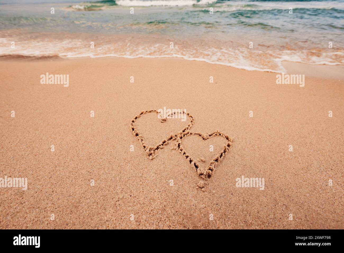 Die Inschrift Ich liebe dich am Meer mit Palmen Stockfoto