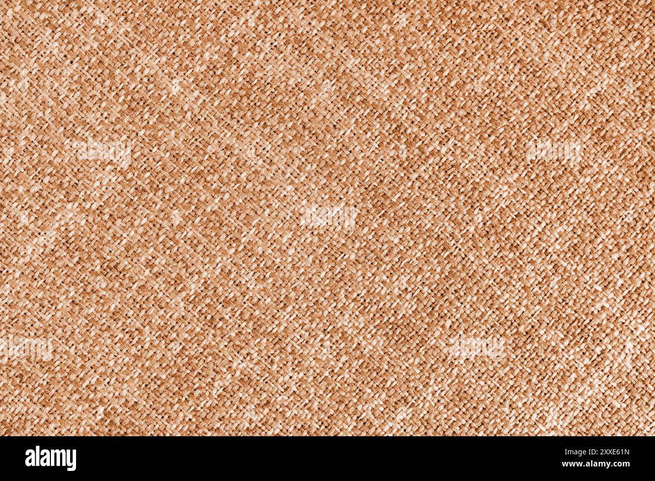 Orangefarbener Polsterung aus Jacquard-Gewebe mit grober Diagonalstruktur. Textilhintergrund, Möbel Textilmaterial, Tapete, Hintergrund. Stoffstru Stockfoto