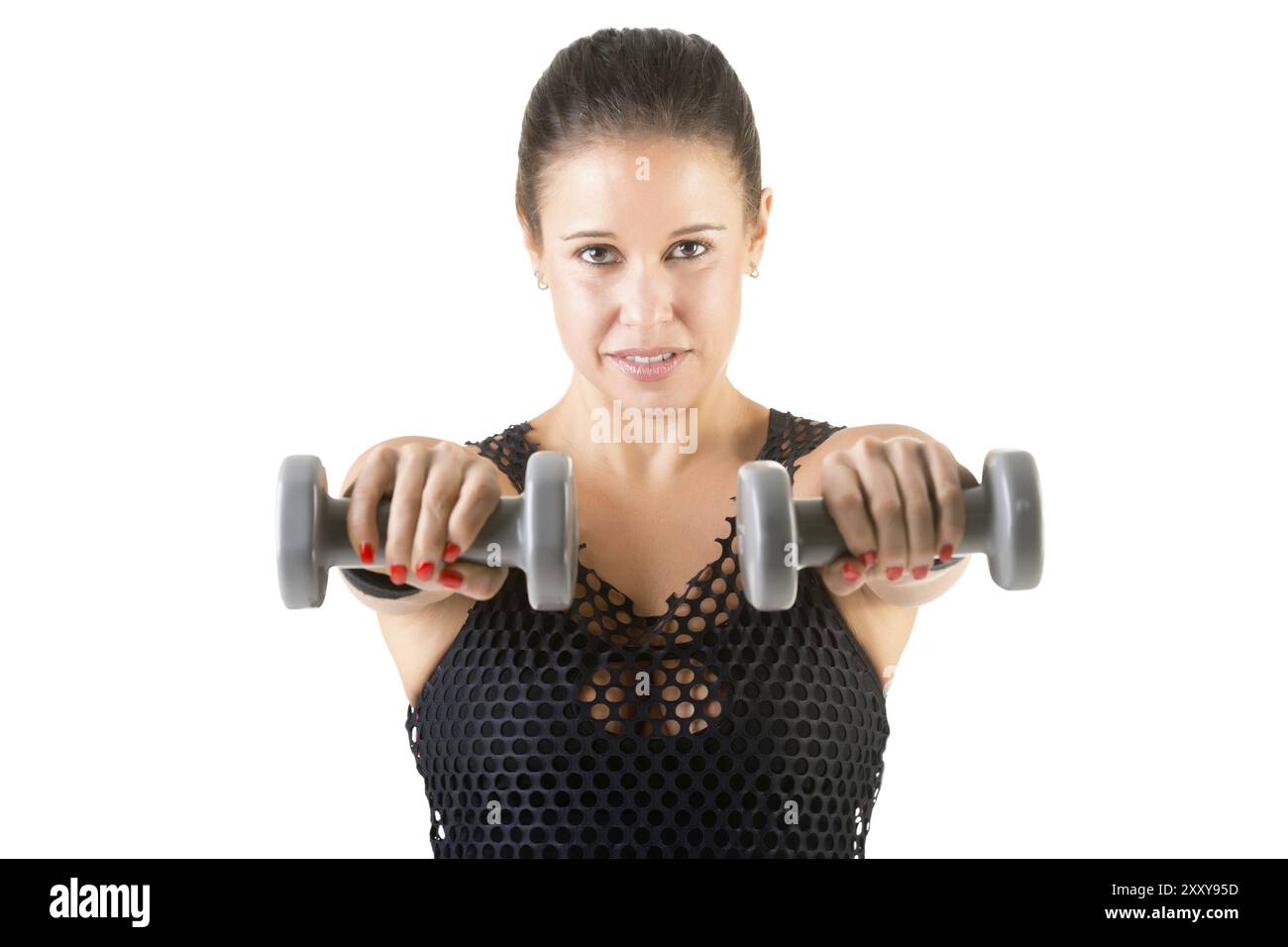 Frau Workout mit Hanteln in einem Fitnessstudio, in einem weißen Hintergrund isoliert Stockfoto