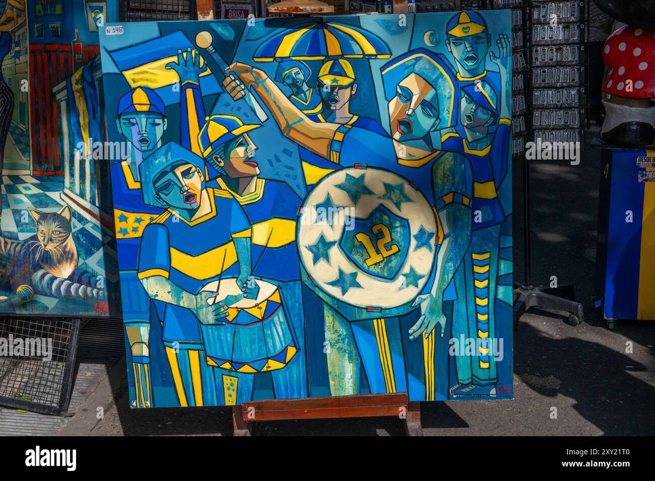 Ein modernes Gemälde von Fußballfans der Boca Juniors zum Verkauf in einem Geschäft in Caminito, La Boca, Buenos Aires, Argentinien. Stockfoto