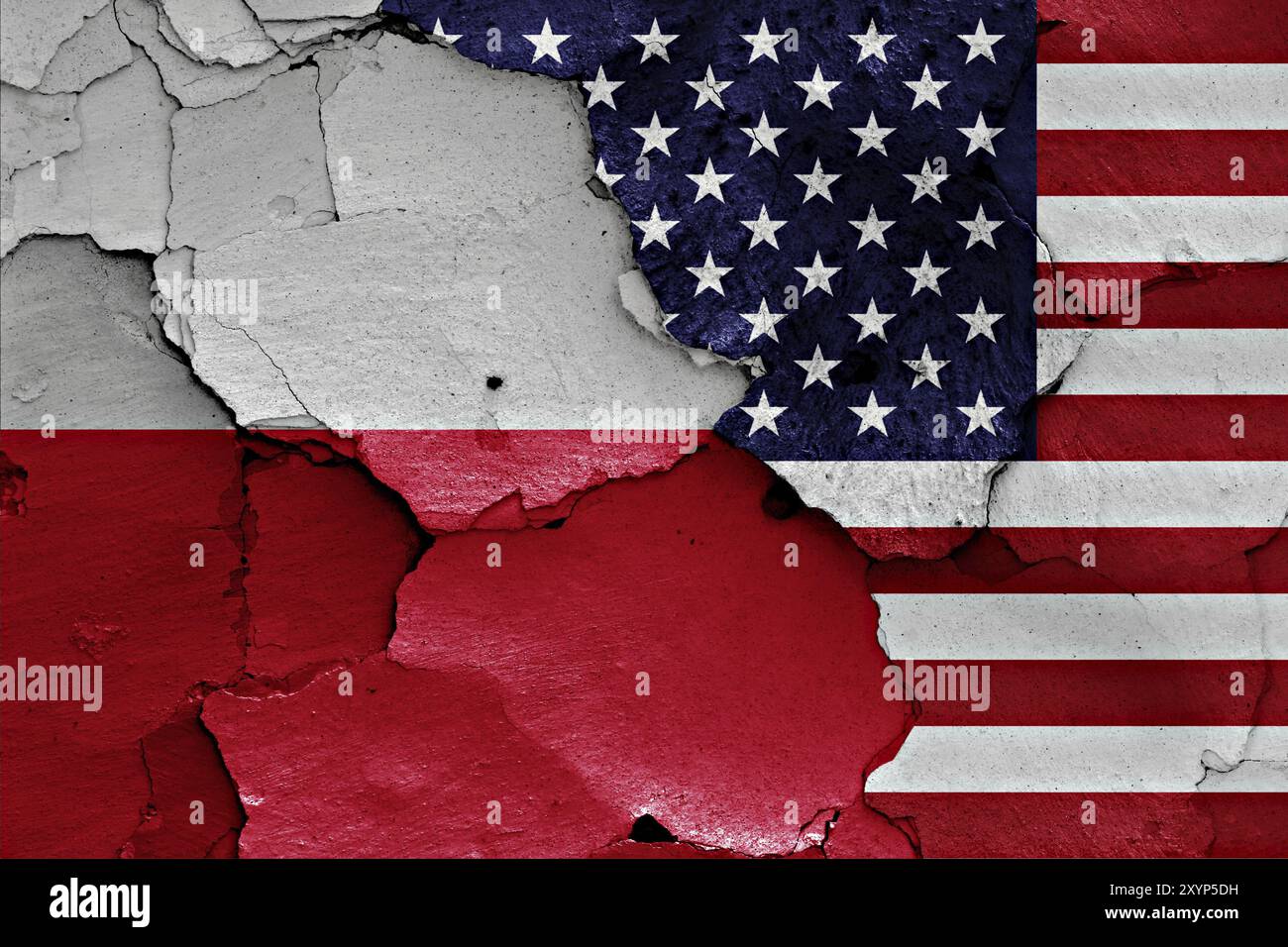Flaggen von Polen und USA auf gerissene Wand gemalt Stockfoto