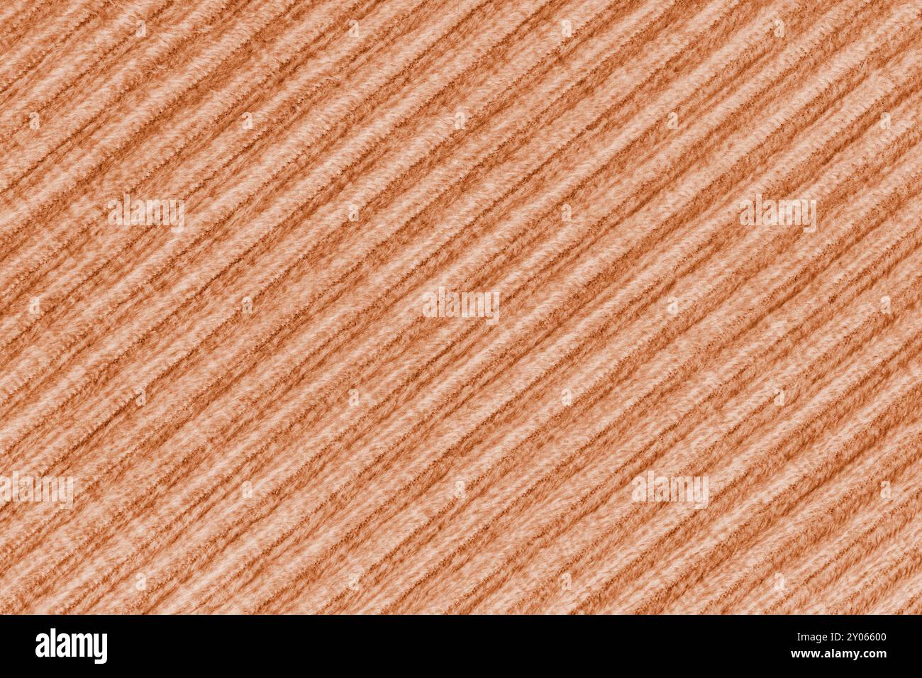 Ridge Textur Hintergrund aus Velours Cordorange Tuch. Großer gerippter, diagonaler, grober gewebter Samtstoff, gestreifter Stoff mit Polsterstruktur, Möbel Stockfoto