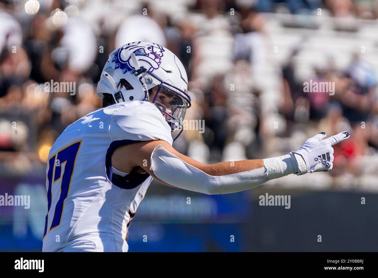 DeKalb, USA. 31. August 2024. Christian Anaya Punkte voraus, um zu signalisieren, dass er beim NCAA 2024 Season Opener für die Northern Illinois University Huskies vs Western Illinois University Leathernecks im Huskie Stadium am 31 2024. August einen ersten Rückschlag erzielte. Endresultat: NIU - 54, WIU 15 (Foto: Raj Chavda/SIPA USA) Credit: SIPA USA/Alamy Live News Stockfoto