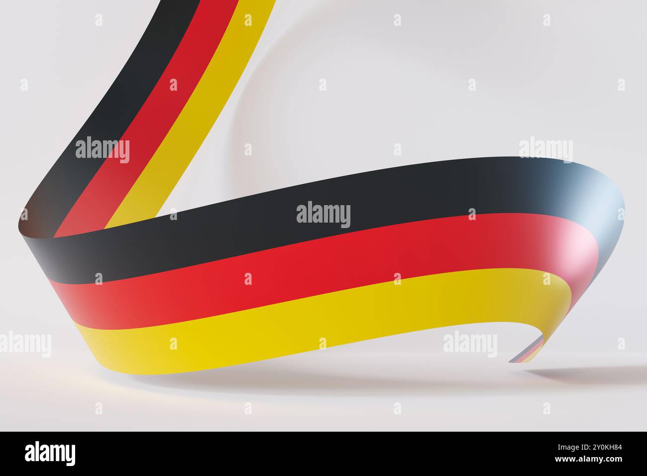 Dynamische Darstellung der Farben der deutschen Flagge in einer fließenden, welligen Form, die eine moderne und künstlerische Interpretation auf weißem Hintergrund schafft. Ideal für Stockfoto