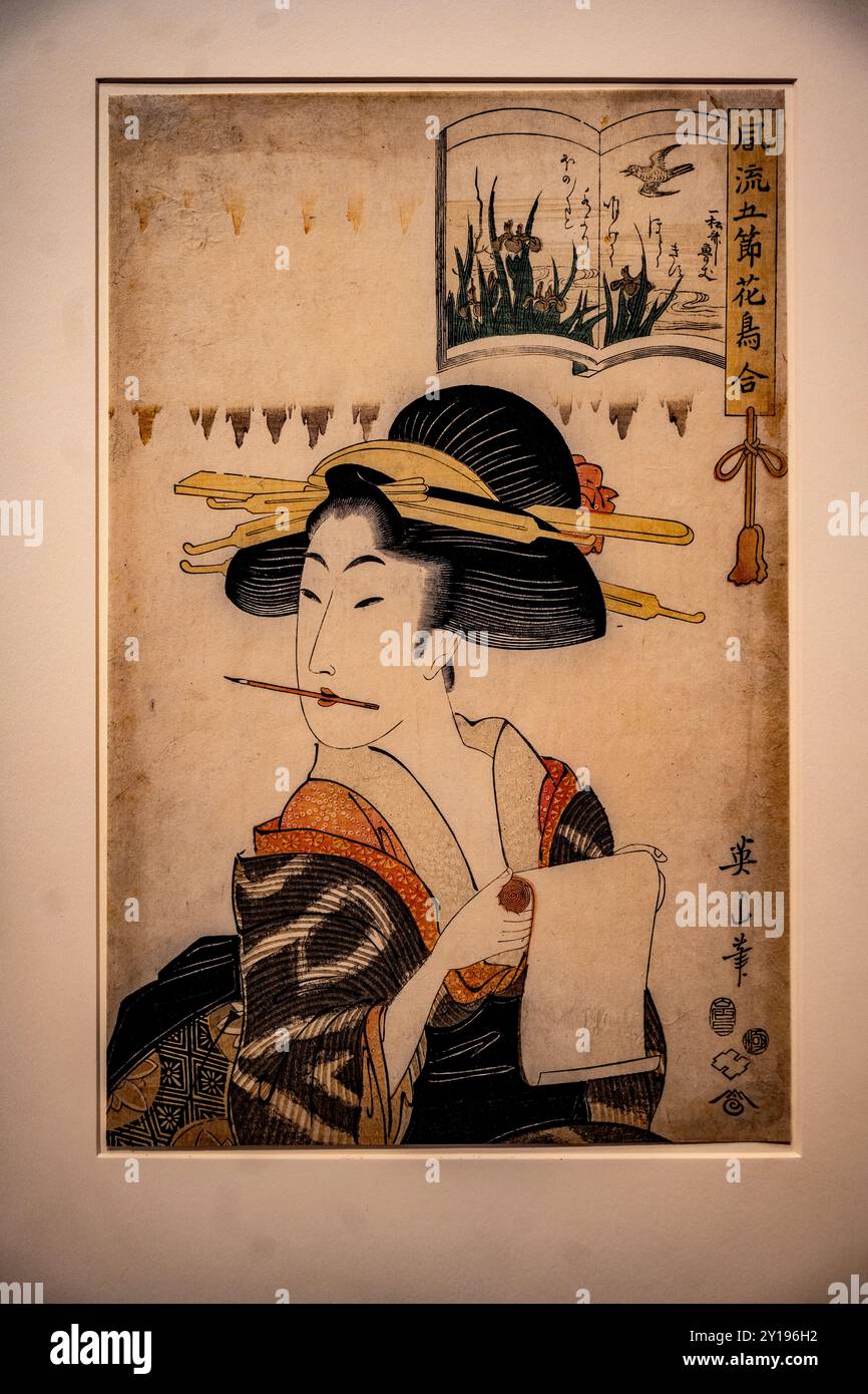 San Francisco, CA, USA - 07-05-2024: Japanischer Holzschnitt. Frau, die einen Brief schreibt, ca. 1810-1815, von Kikuwawa Eian (1787-1687) Stockfoto
