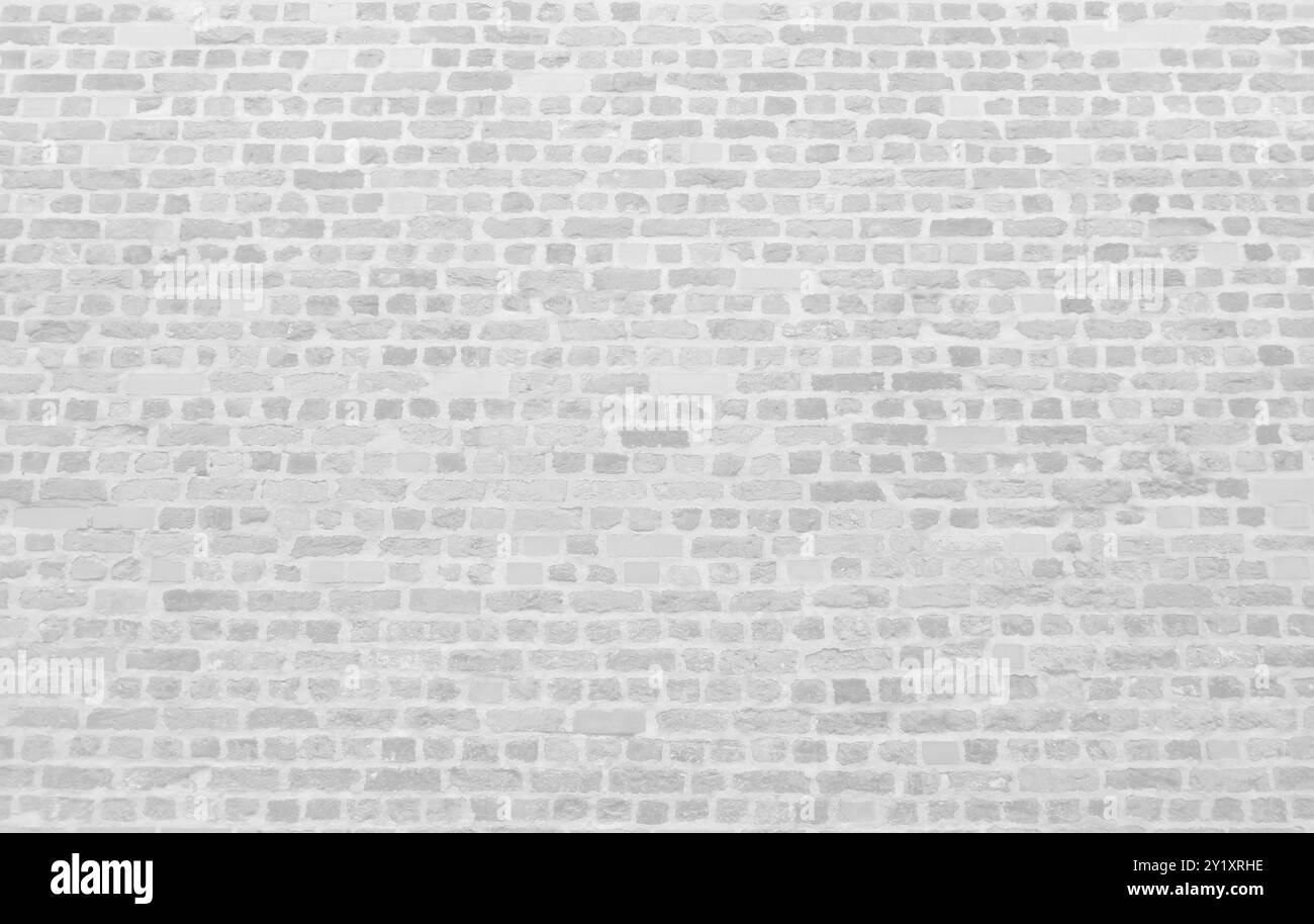 Altes weißes Backsteinmauermaterial mit Hintergrunddesign. Stockfoto