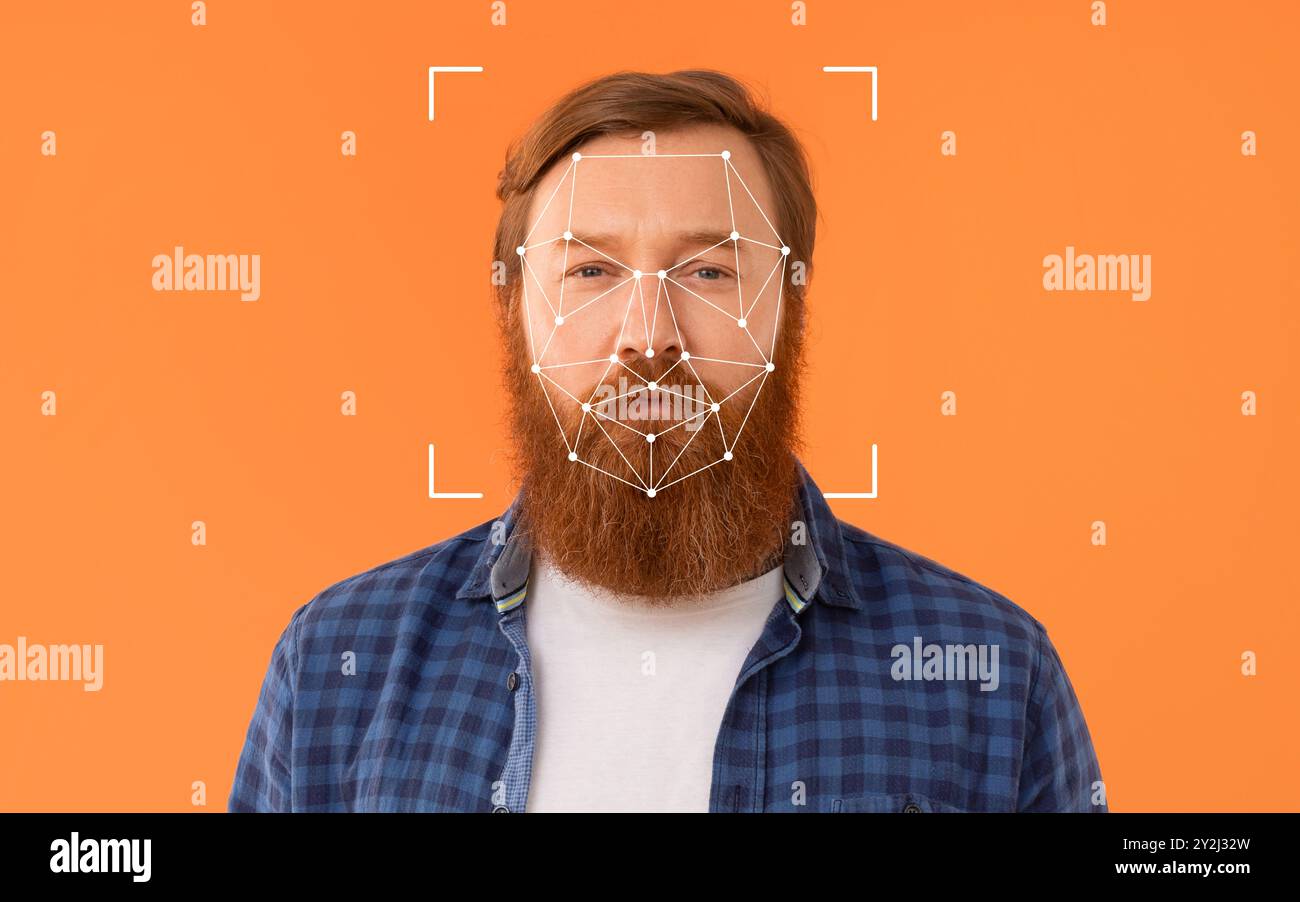 Mann mit Gesichtserkennungstechnologie auf orangefarbenem Hintergrund Stockfoto