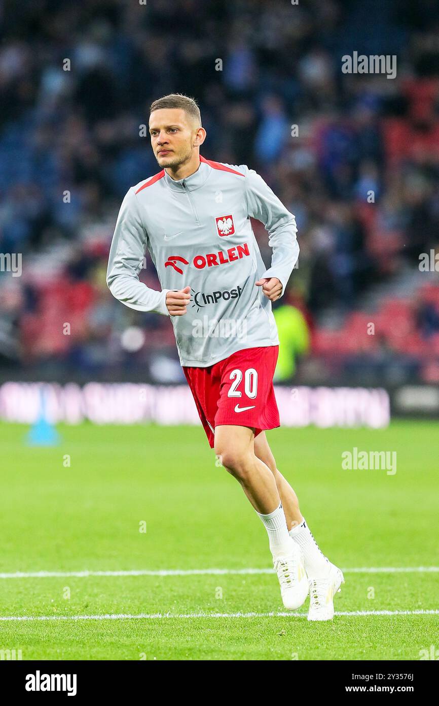 SEBASTIAN SZYMANSKI, professioneller Fußballspieler, spielt für die polnische Nationalmannschaft. Bild, das während eines Aufwärmtrainings und vor dem Spiel aufgenommen wurde. Stockfoto