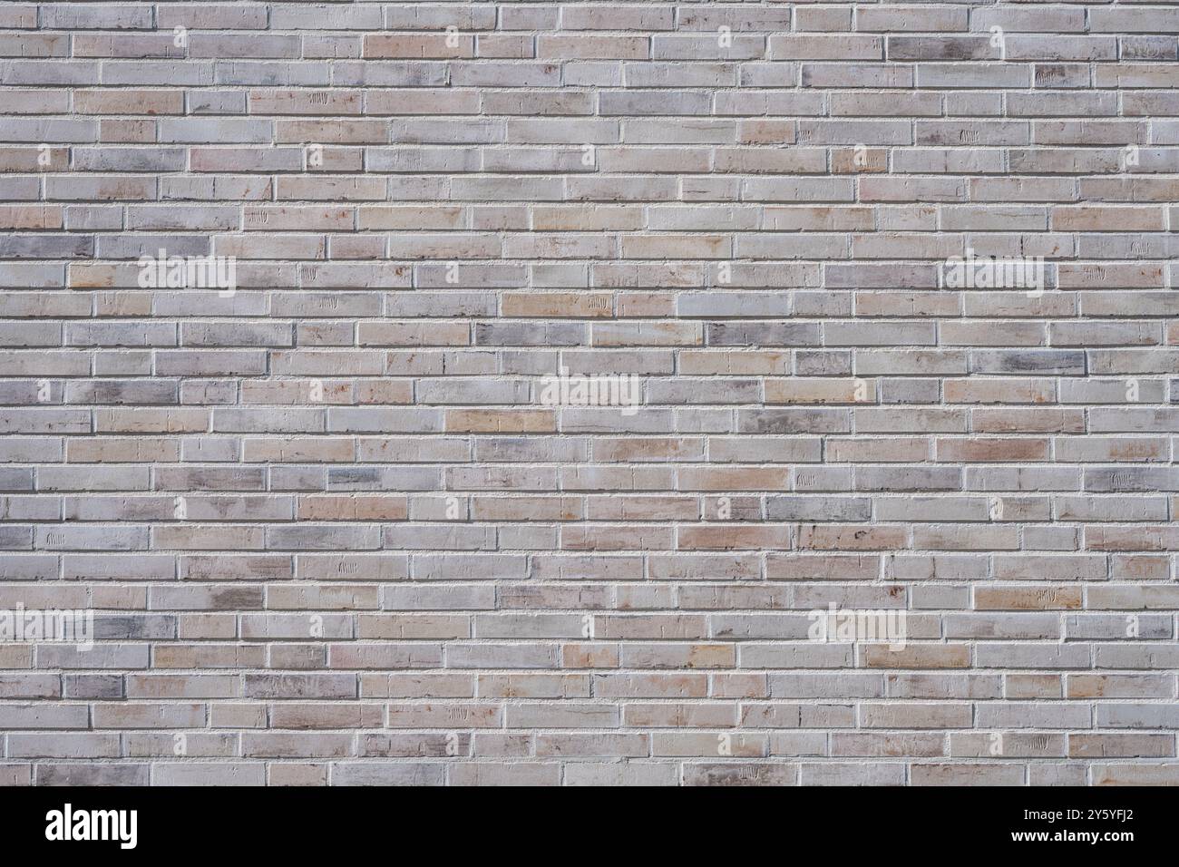 Hintergrund einer Wand aus hellbraunen Klinkerziegeln Stockfoto