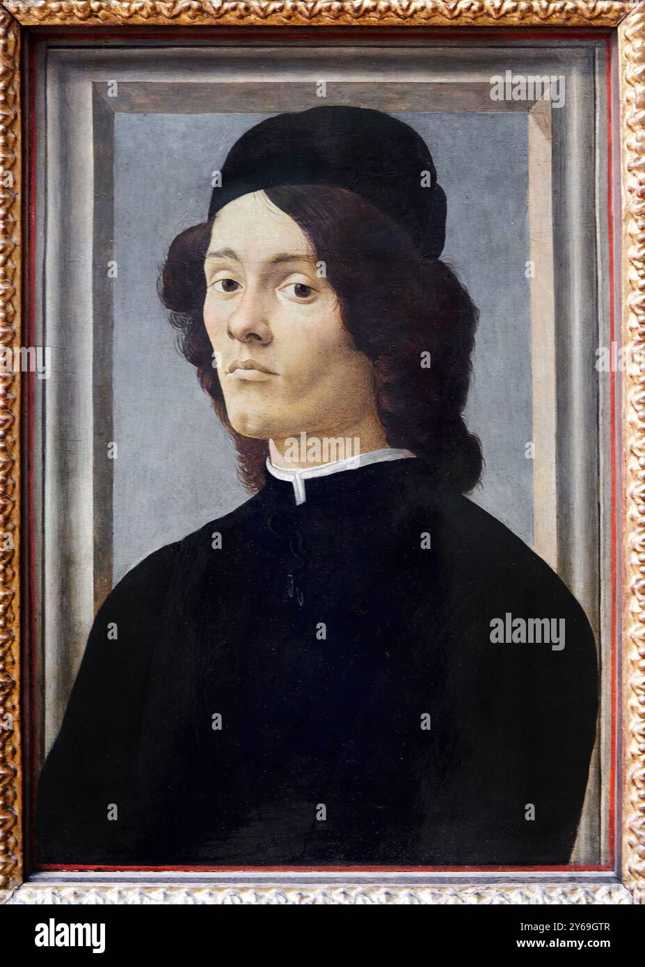 Porträt eines jungen Mannes, Gemälde auf Tafel (Pappel), um 1475-1500, Alessandro FILIPEPI, dit BOTTICELLI,. Florenz, Vers 1445 - Florenz, 1510, Musée du Louvre, Paris, Frankreich. Stockfoto