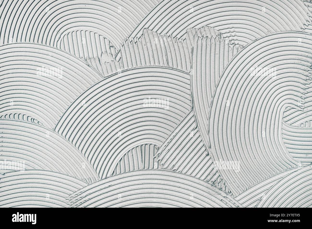 Dekorative Reliefputzwand mit einem einzigartigen Muster als Hintergrund Stockfoto