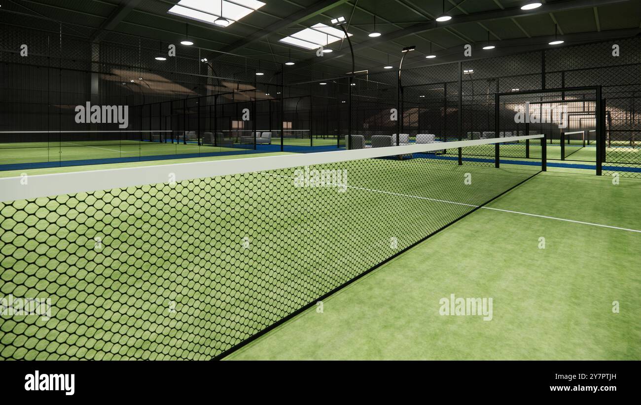 Nahaufnahme Padel Paddle Tennis Netz auf grüner Oberfläche. Im Hangar-Gebäude Stockfoto