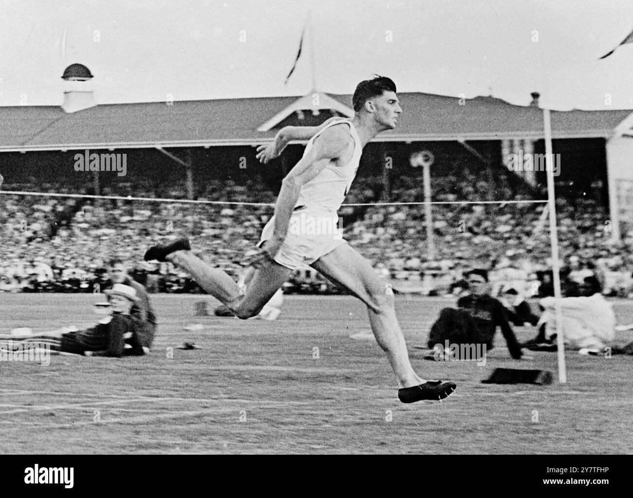 Am 11. Februar 1950 gewann J F Treloar (Australien) das 100 Yards-Rennen bei den Empire Games in Auckland, Neuseeland. Seine Zeit war 9,7 Sekunden. W de Gruchy (Australien) wurde Zweiter und D A Pettie (Kanada) Dritter. Stockfoto