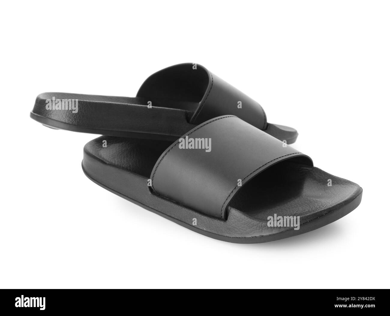 Schwarze weibliche Flip-Flops auf weißem Hintergrund Stockfoto