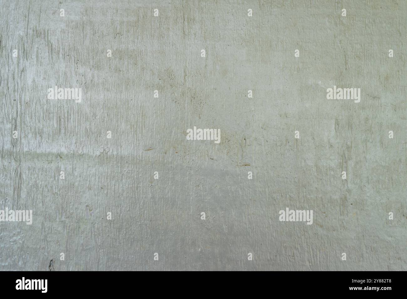 Abstrakte minimalistische Wandstruktur mit gedämpftem Grün. Stockfoto