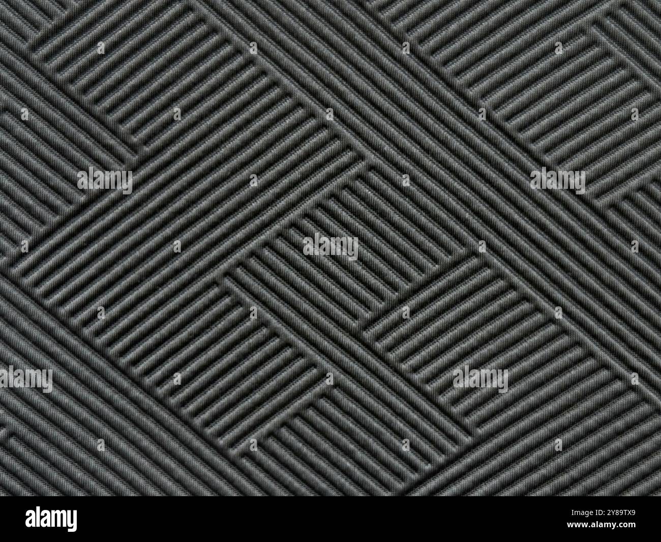 Nahaufnahme der Textur eines schwarzen diagonalen schrägen Musters, eines schwarzen Webmusters. Ein modernes, zeitgenössisches futuristisches Element. Schwarze geneigte geometrische Textur Stockfoto