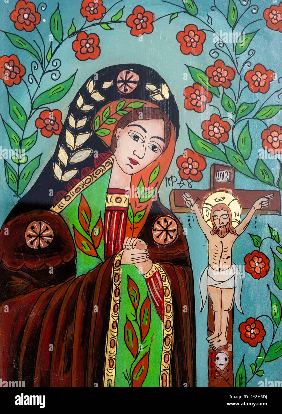 Lebendige religiöse Ikone mit der Jungfrau Maria und Christus, verziert mit komplizierten Blumenmustern. Stockfoto