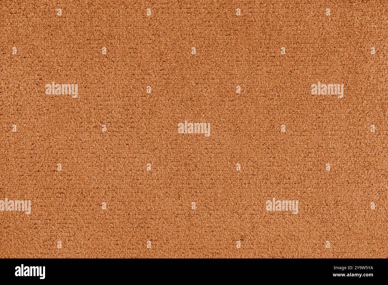 Einfarbige orangefarbene Mikrofaser-Textur. Struktur der Veloursleder-Polsterung Nahaufnahme, Makro. Tapete, Hintergrund, textiler Hintergrund. Stockfoto