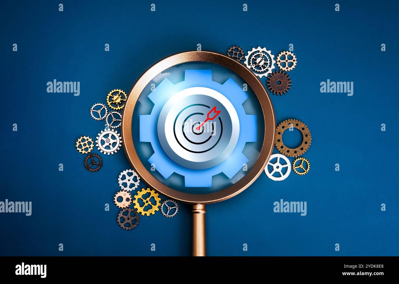 Trends auf dem Geschäftsmarkt, Erfolgsablauf, Konzept für Marketing Research Management Tools. Nahaufnahme großes Zielsymbol mit Zahnrad, Fokus in Lupe W Stockfoto