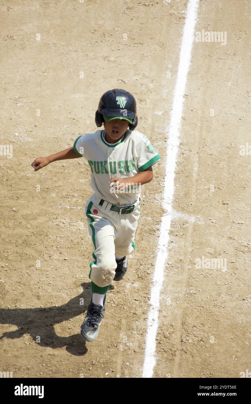 Jugend-Baseballläufer Stockfoto