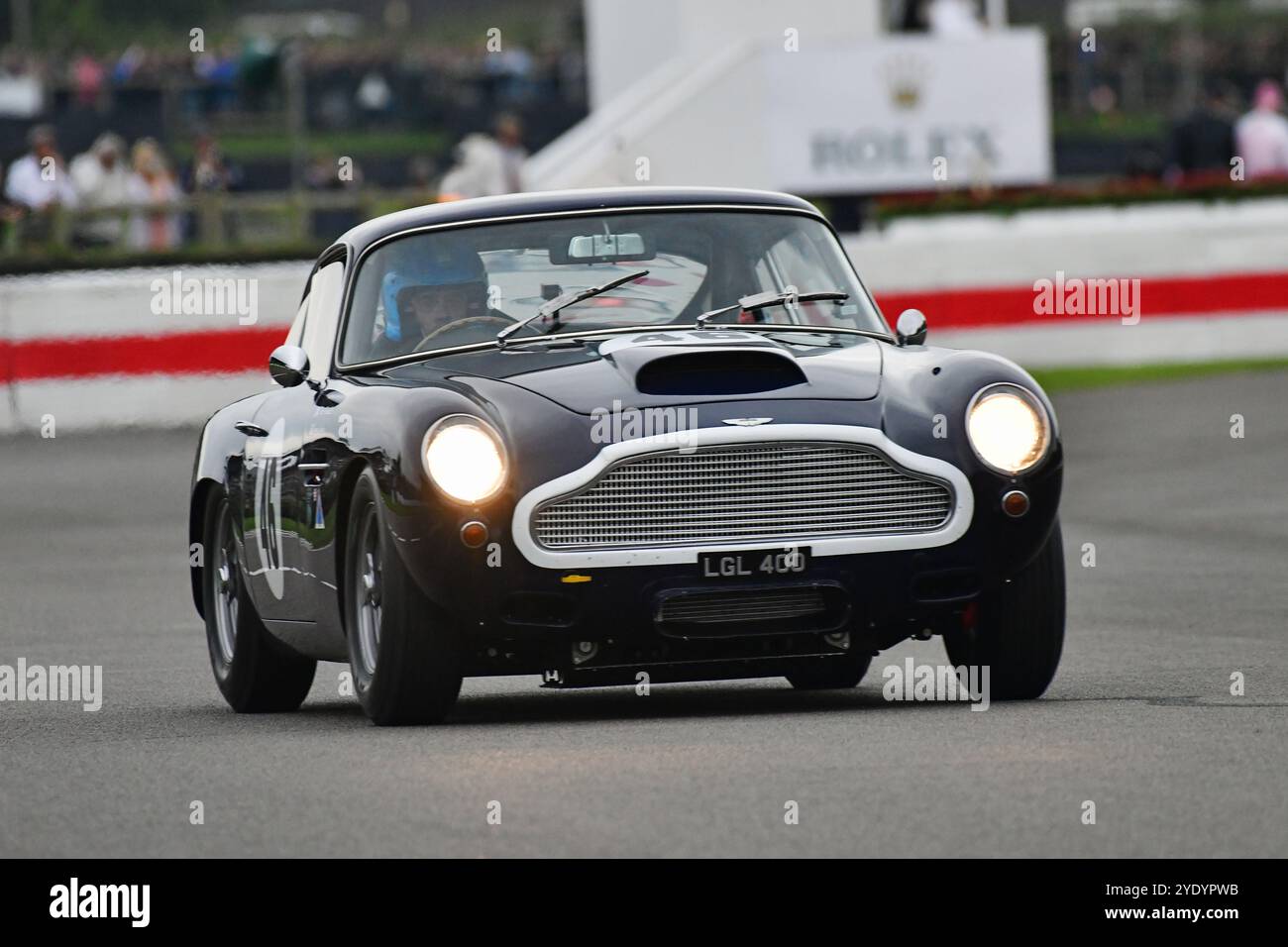 Jimmie Johnson, Dario Franchitti, Aston Martin DB4GT, Stirling Moss Memorial Trophy, mit GT-Fahrzeugen mit geschlossenem Cockpit, die vor 1963 gefahren wurden Stockfoto