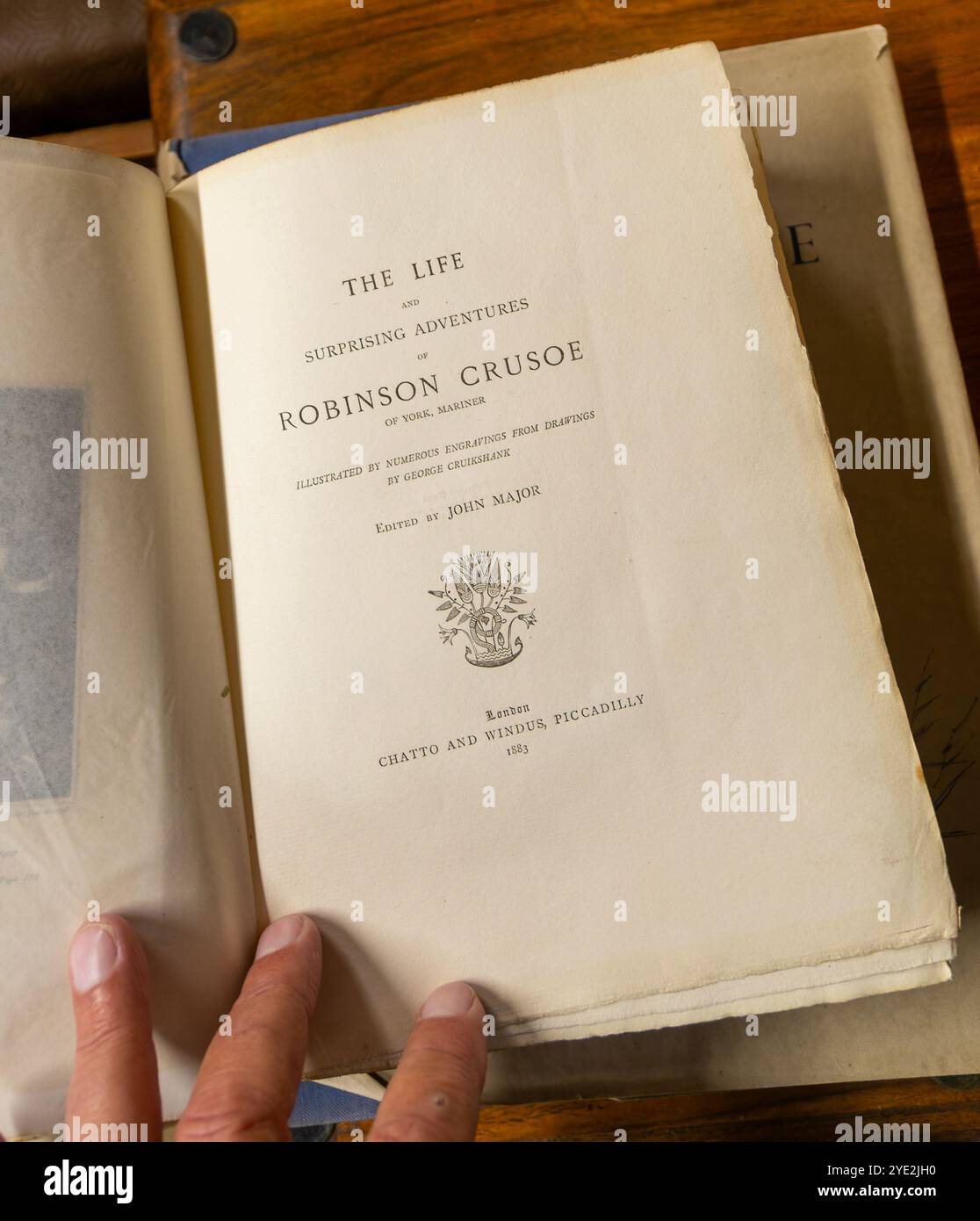 Titelseite des Robinson Crusoe Buches von Daniel Defoe, veröffentlicht 1883 Chatto and Windus, UK Stockfoto