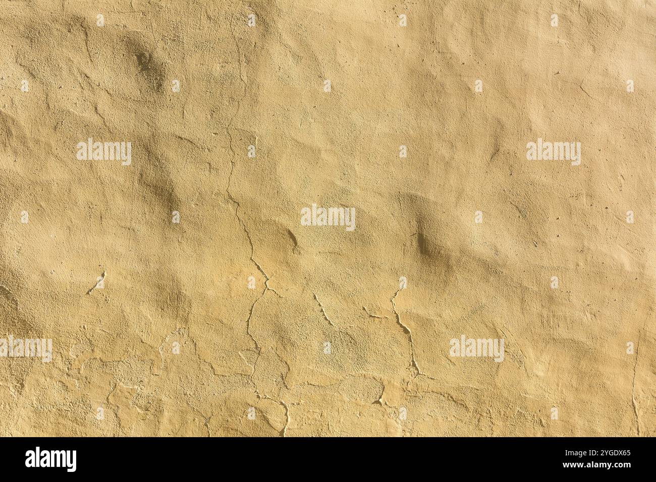 Hintergrund gelb, beige verputzte Wand Stockfoto