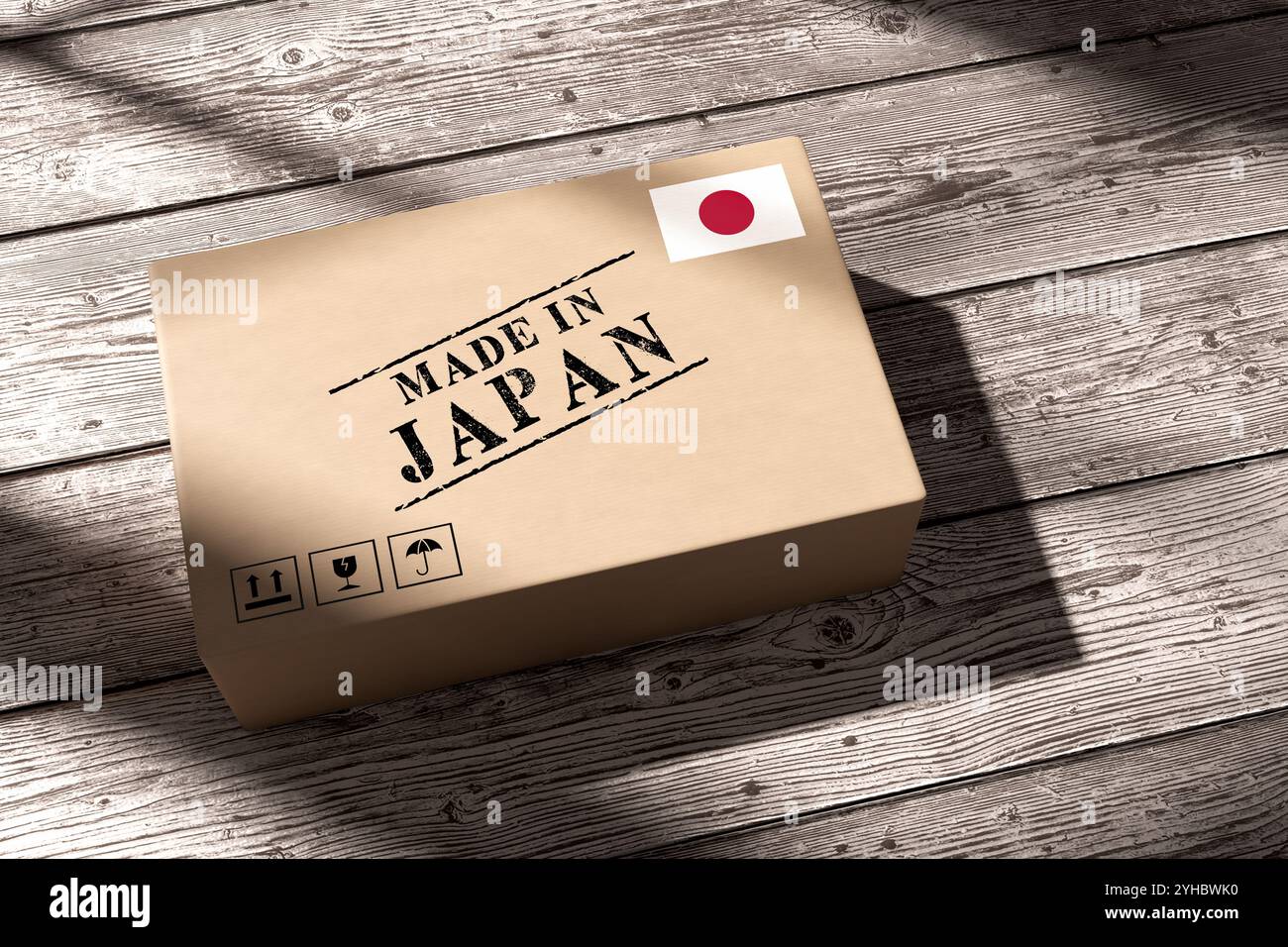Papppaket mit einem Etikett Made in Japan auf Holzdielen. Japanische Produktion und Produktion. Globaler Versand, Import, Export und Logistik Stockfoto
