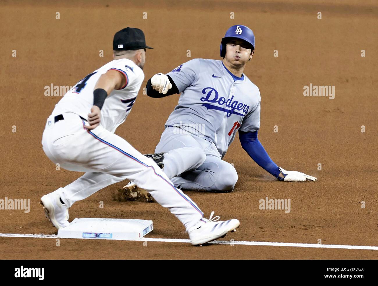 FILE: Los Angeles Dodgers Japanese Shohei Ohtani steals third base in ...
