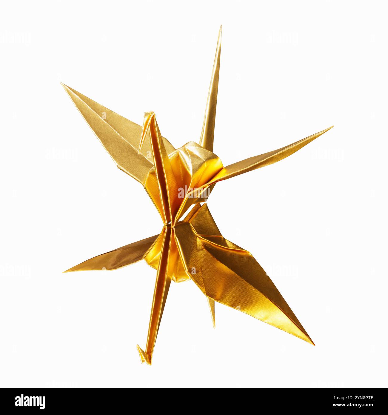 Papierkran aus goldenem Origami Stockfoto