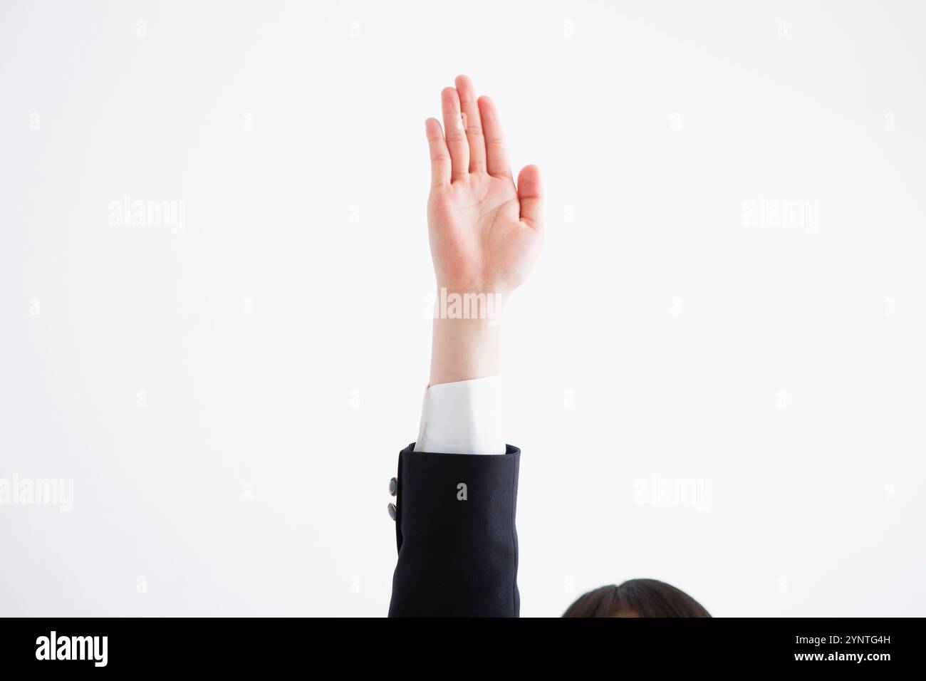 Schulmädchen, hob ihre hand Stockfoto
