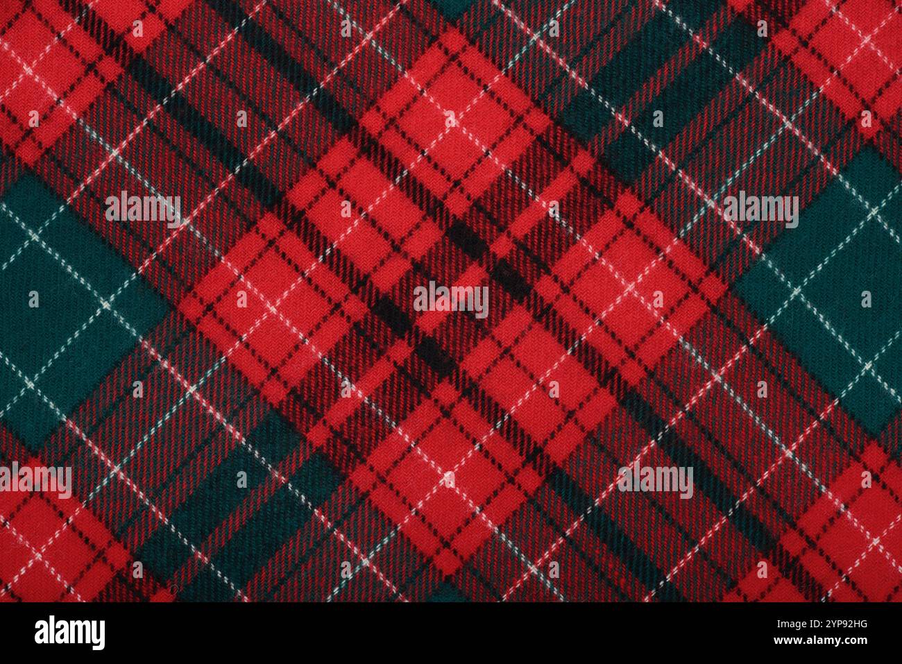 Karo-Karo-Karo-Design mit Weihnachtsschottenmuster. Stoffmuster Hintergrund schottischen Stils. Silvester-Textildekoration, Draufsicht. Stockfoto