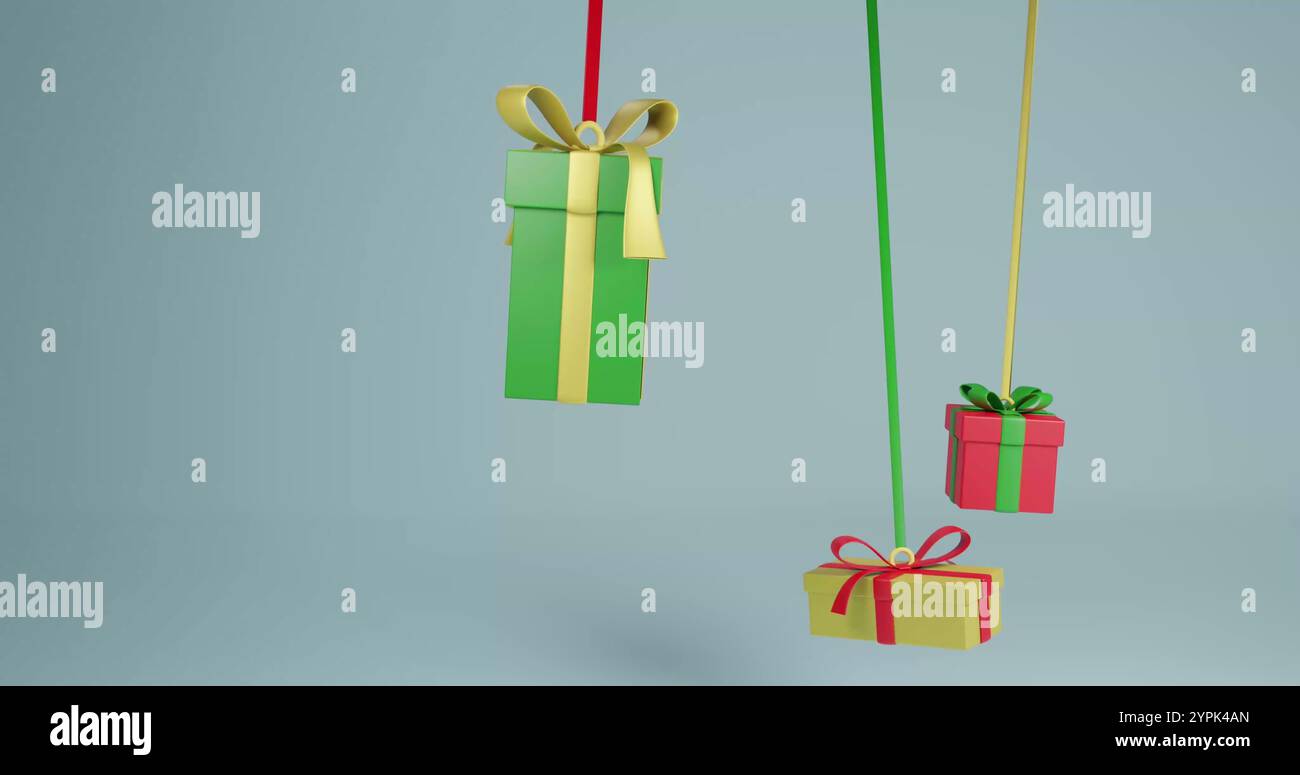 Farbenfrohe Geschenkboxen hängen an einem schlichten Hintergrund Stockfoto